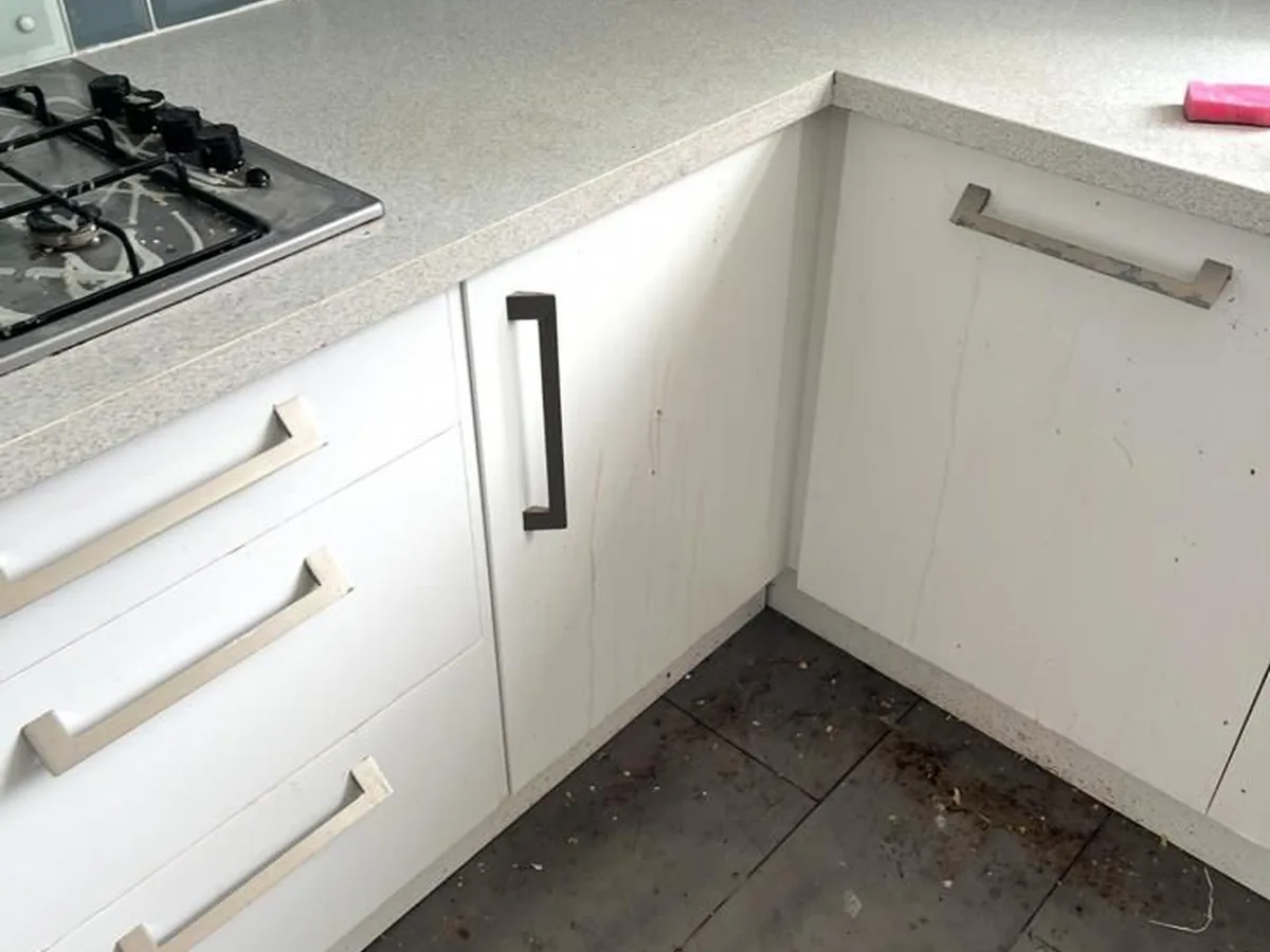 Dirty kitchen floor before a deep clean